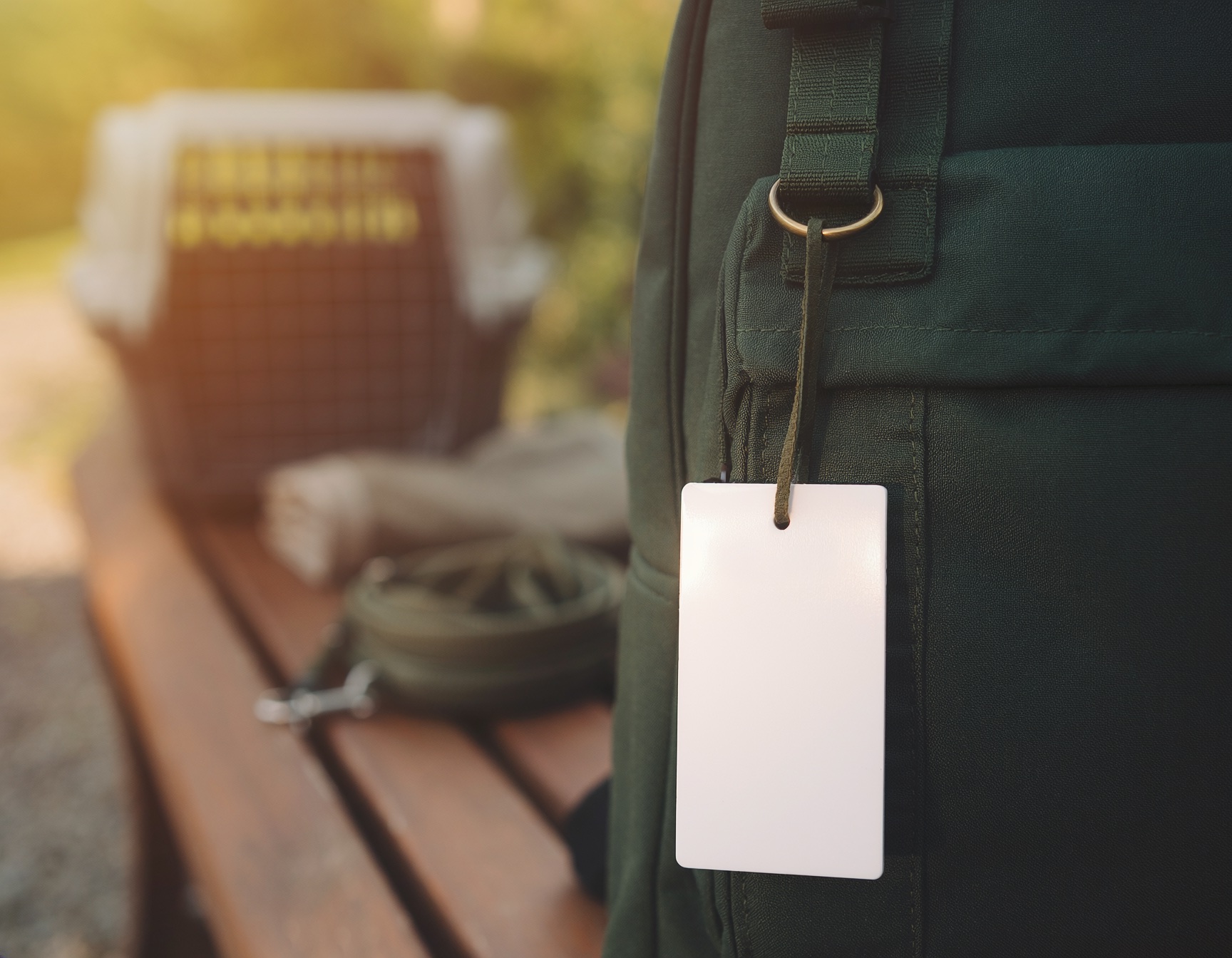 A Critterfolio care QR tag attached to a travel bag